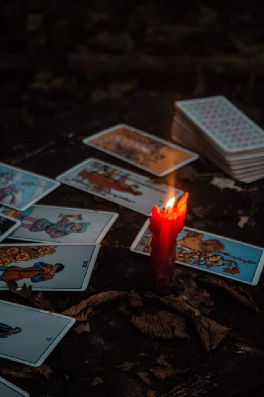 Tarot cards laid out by candlelight